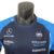 Camisa masculina azul da Williams Racing da temporada 23/24 de Fórmula 1, com logos de patrocinadores.