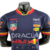 Camisa masculina da Red Bull Racing da temporada 23/24, na cor azul, com logotipos de patrocinadores.