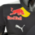 Camisa masculina preta da Red Bull para a temporada de Fórmula 1 23/24, com logotipo da equipe e da Puma.