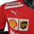 Camisa masculina da Ferrari 23/24 da Fórmula 1, na cor vermelha, destacando logos da Puma, Shell e UPS.