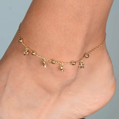 Tornozeleira Dourada de Estrelas e Esferas - comprar online