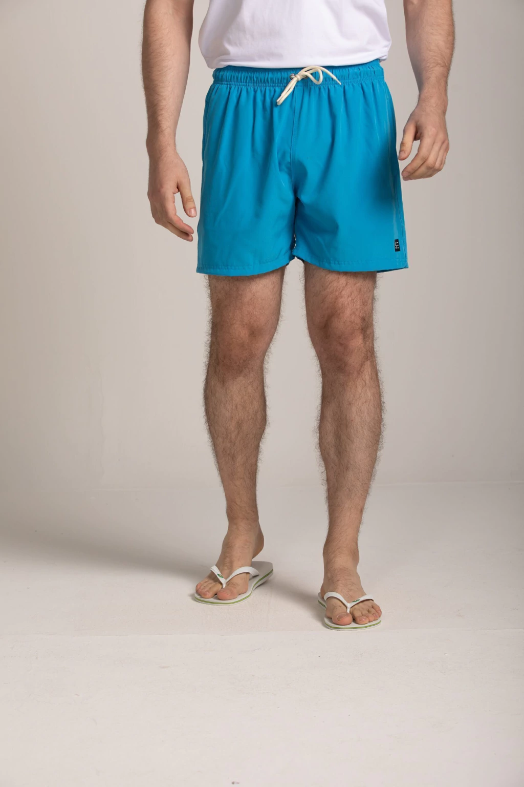 SHORTS PRAIA LISO ELASTANO BOLSO EMBUTIDO