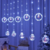 Cortina com 135 LEDs Branco Frio 5 argolas e 5 bolas figuras natalinas 3 metros bivolt. - comprar online