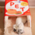 Camita de gato en forma de caja de harina para hotcakes, ultra suave y afelpada por dentro. Abierta con gatito acostado.