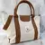 BOLSO LISO CON AZA RÍGIDA BASILEA - comprar online