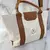 BOLSO LISO CON AZA RÍGIDA BASILEA en internet