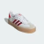 Tênis Adidas Samba na cor branca com detalhes em vermelho, modelo "Cloud White Better Scarlet".