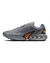 Tênis Nike Air Max Dn "Particle Grey" na cor cinza, com detalhes em laranja e design moderno, disponível na Supernova Sneakers.