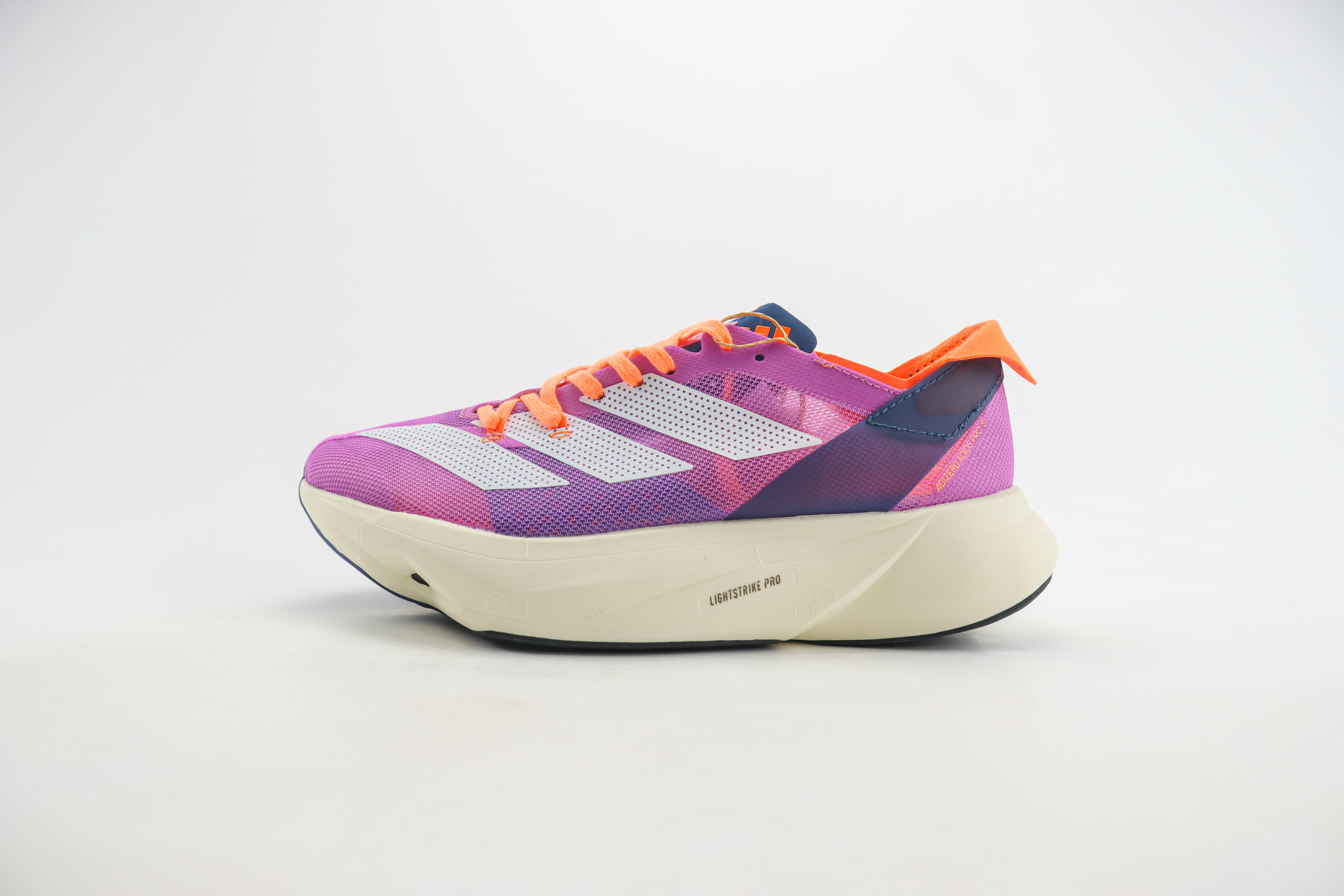 Imagem do Tênis Adidas Adizero Adios Pro 3 na cor rosa, com detalhes em laranja e azul, disponível na Supernova Sneakers.