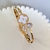Bracelete Trevo Madrepérola Aço Inoxidável Dourado na internet