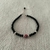Pulsera cristales negros y ojo turco rojo