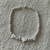 Pulsera bolitas de acero y estrellitas
