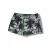 Sunga infantil fit boxer com estampa de palmeiras em tons de verde e preto, ideal para praia e piscina.