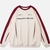 Buzo blanco oversize con detalles en rojo