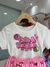 conjunto MOMI blusa bege com estampas rosa neon e short estamapado - Bia Mundo Kids