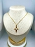 Colar Cruz aço dourado com detalhe branco (50cm) na internet