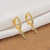 Brinco Argola com Cruz Cravejado com Zircônias Banhado Ouro 18k na internet