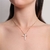 Colar Cruz com Zircônias Cristal - Banho de Ouro - comprar online