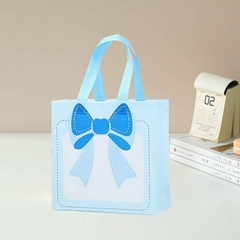 Bolsa de friselina con estampa moño. Precio por unidad.