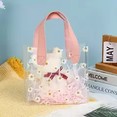 Imagen de Bolsa pvc cristal con margaritas y manija de cuerina rosa. Precio x unidad.