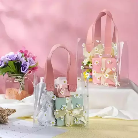 Bolsa pvc cristal con margaritas y manija de cuerina rosa. Precio x unidad. - comprar online