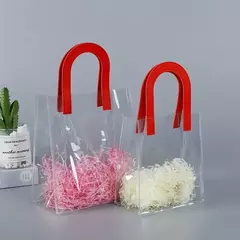 Bolsa de pvc con manija de cuerina. 5 colores disponibles. Precio por unidad - Capkelitos mayorista