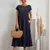 Vestido solto de algodão e linho sem mangas com bolsos - comprar online