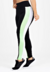 Calça legging preta com listras laterais brancas e verdes, ideal para moda fitness.