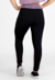 Calça legging preta com detalhe violeta vista de trás, ideal para moda fitness.