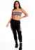 Conjunto fitness composto por calça legging preta com detalhes em violeta e cropped tomara que caia preto com violeta, modelo feminino.