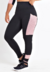 Calça feminina legging fitness preta com detalhes em rosa, ideal para atividades físicas.