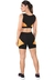 Conjunto fitness cropped preto com detalhes amarelos, incluindo cropped e shorts, visto de trás.