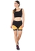 Mulher usando conjunto fitness cropped preto com amarelo e shorts preto com amarelo, posando para a foto.