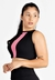 Cropped fitness longo preto com detalhes em rosa, modelo feminino posando.