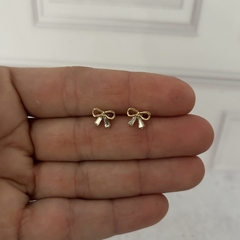 Aros de acero dorado moño con strass - comprar online