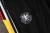 Imagem do Conjunto Alemanha Treino 24/25 - Masculino Adidas Zipper curto - Branco com preto e detalhes amarelo e vermelho e calça preta