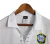 Camisa Seleção Brasileira III Retrô 2004 Torcedor Masculina - Branco com detalhes em azul e brasão CDB - loja online