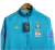 Jaqueta Corta-Vento Brasil 22/23 Masculino Nike - Azul com detalhes em amarelo - tienda online