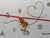 Pulsera hilo rojo con dije om
