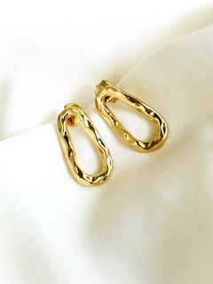 Brinco orgânico ondas dourado