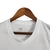 Camisa regata branca do São Paulo I 24/25, da marca New Balance, pendurada em um cabide.