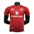 Camisa vermelha do Manchester United, modelo 2024/2025, da Adidas, com logo do time e patrocinador na frente.
