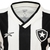 Camisa feminina do Botafogo, branca e preta, com detalhes em preto e logo do clube.