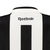 Vista traseira da camisa Botafogo I 24/25 feminina da Reebok, destacando a marca Reebok e o número 1 em preto e branco.