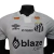Camisa do Santos versão jogador 24/25 em fundo branco, com detalhes em preto e logotipos de patrocinadores. neymar santos peixe pele vila belmiro