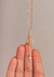 Colar Gravatinha Nossa Senhora Dourado na internet