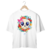 Camiseta oversized branca com estampa de uma caveira kawaii rodeada por flores coloridas.