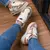 TÊNIS FEMININO NEW BALANCE NOBUCK
