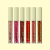 Seis batons líquidos Comfort Lips da linha Silk Skin em cores que variam do nude, ao rosa, vermelho e marrom. Frasco transparente e tampa verde pastel. 