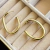 BRINCO ARGOLA CANO LISO - B. OURO 18K - comprar online
